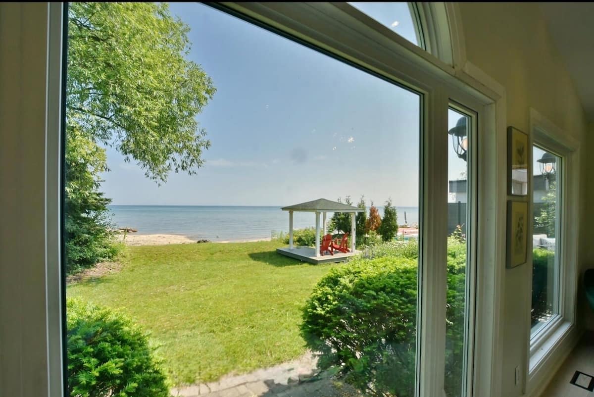 The garden and shoreline seen from Collingwood Waterfront Retreat
